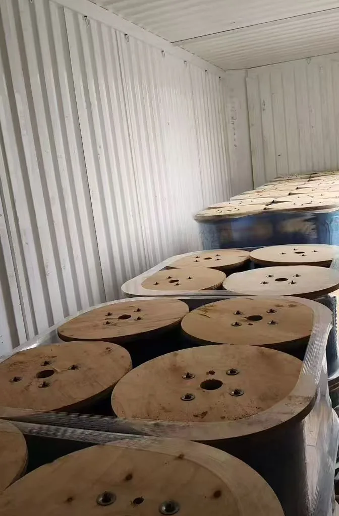 Close view of wooden wire-rope reels with protective film before final wrap